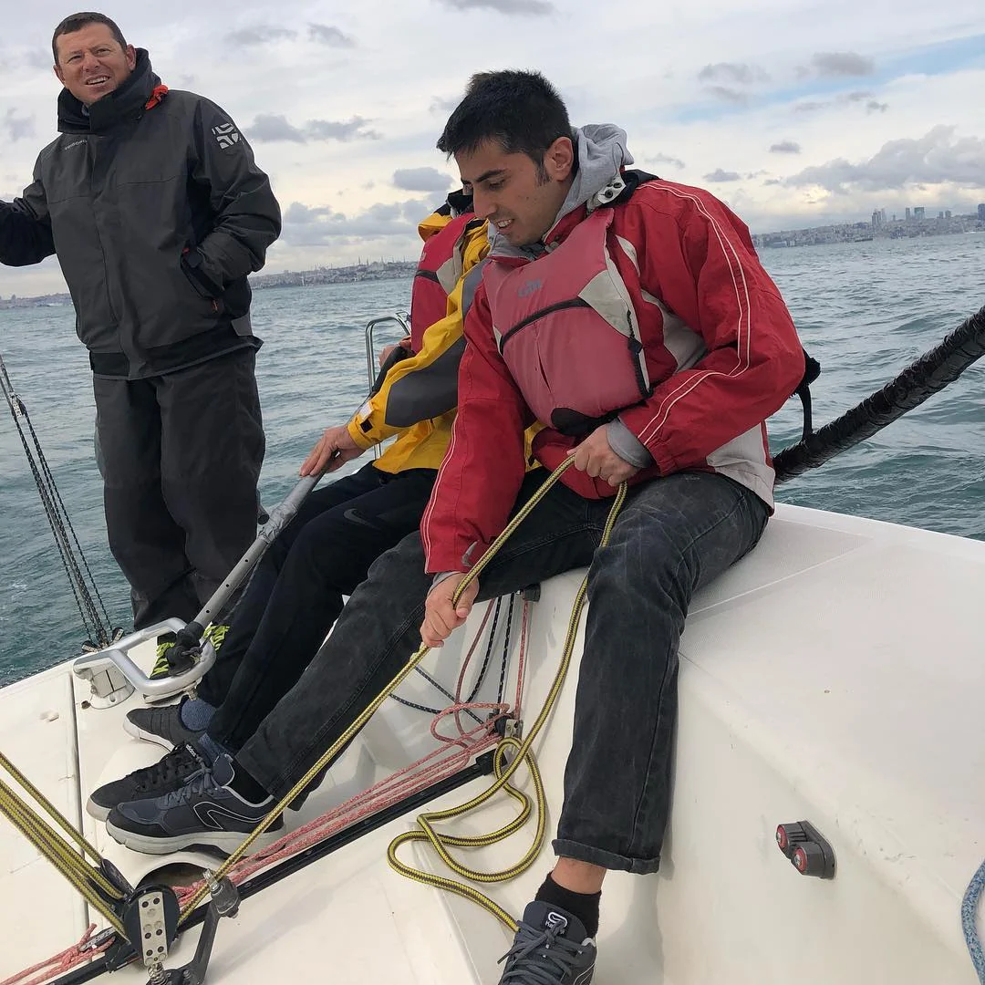 Teamwork on board in life jackets, from my sailing post.
