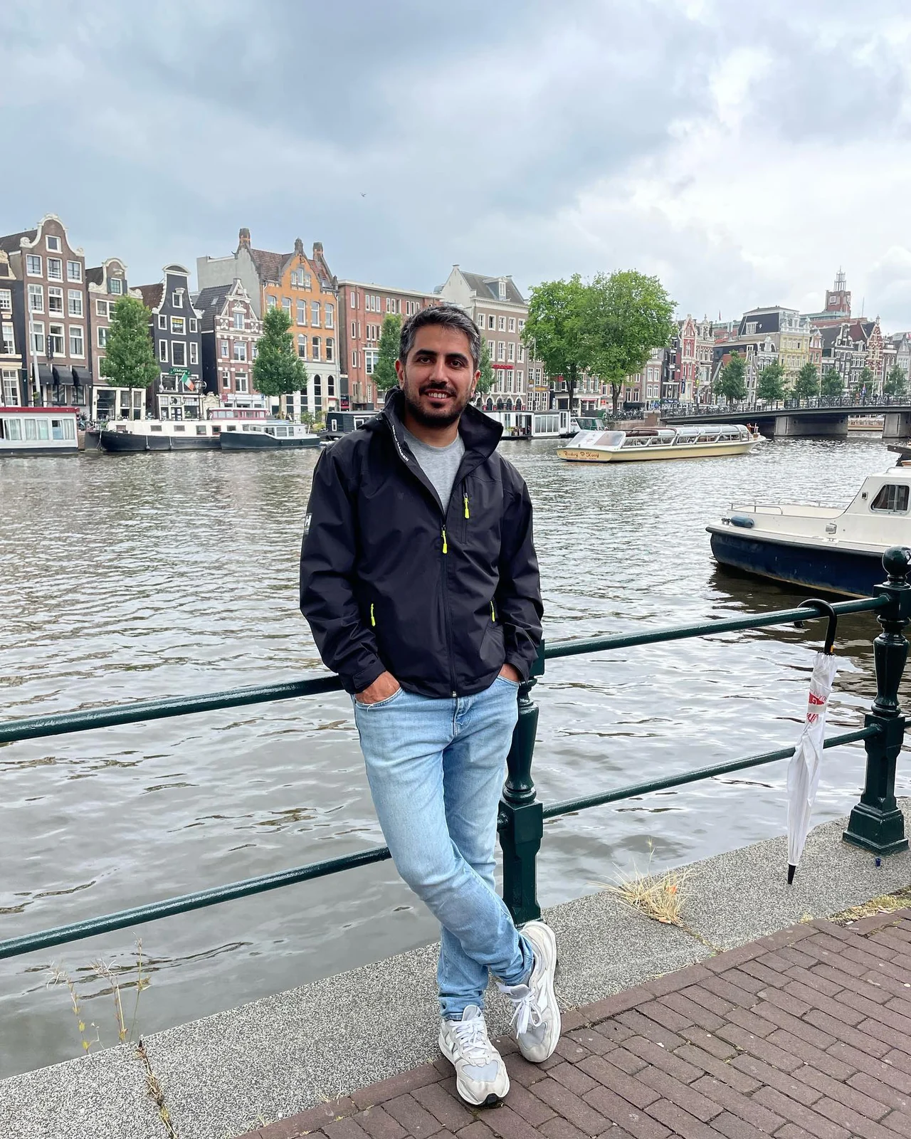 A photo of me by a canal on my trip to the Netherlands.