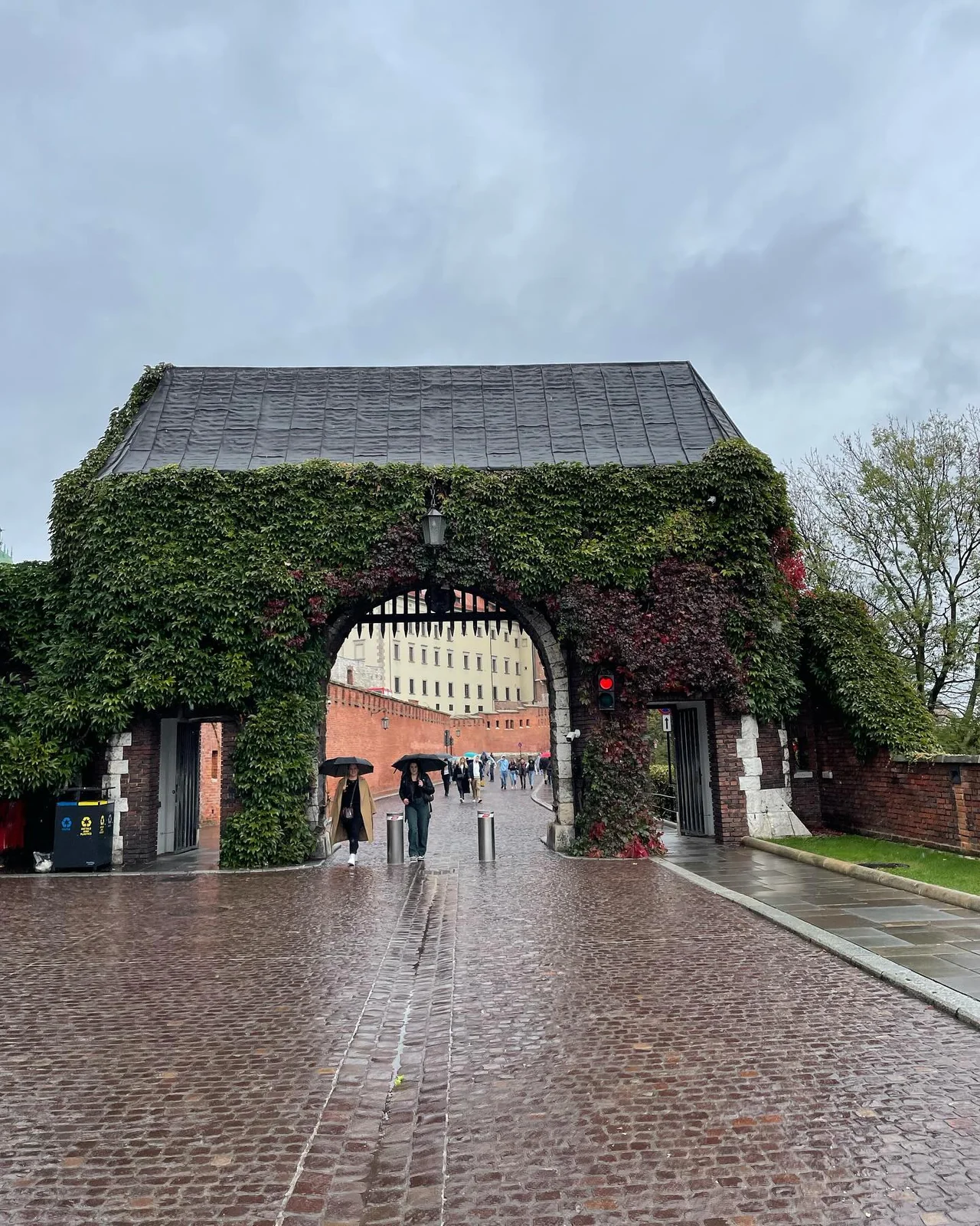 A historic gate and stone building from my trip to Poland.